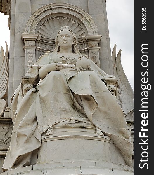 Detail of the marble statue of Queen Victoria at the gates of Buckingham Palace in London. Detail of the marble statue of Queen Victoria at the gates of Buckingham Palace in London
