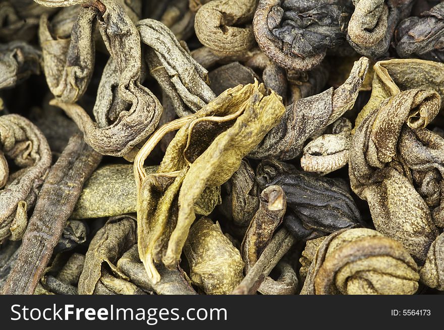 Extrime closeup of dried green tea leaves. Extrime closeup of dried green tea leaves