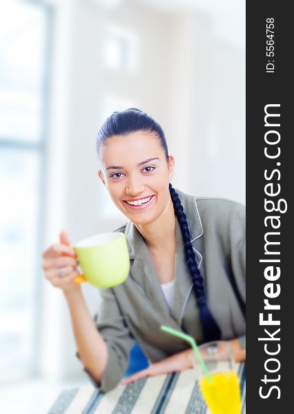 Young businesswoman having coffee break
