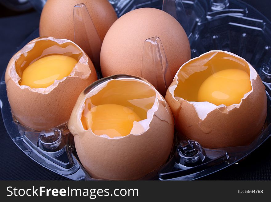 Fresh eggs on black background