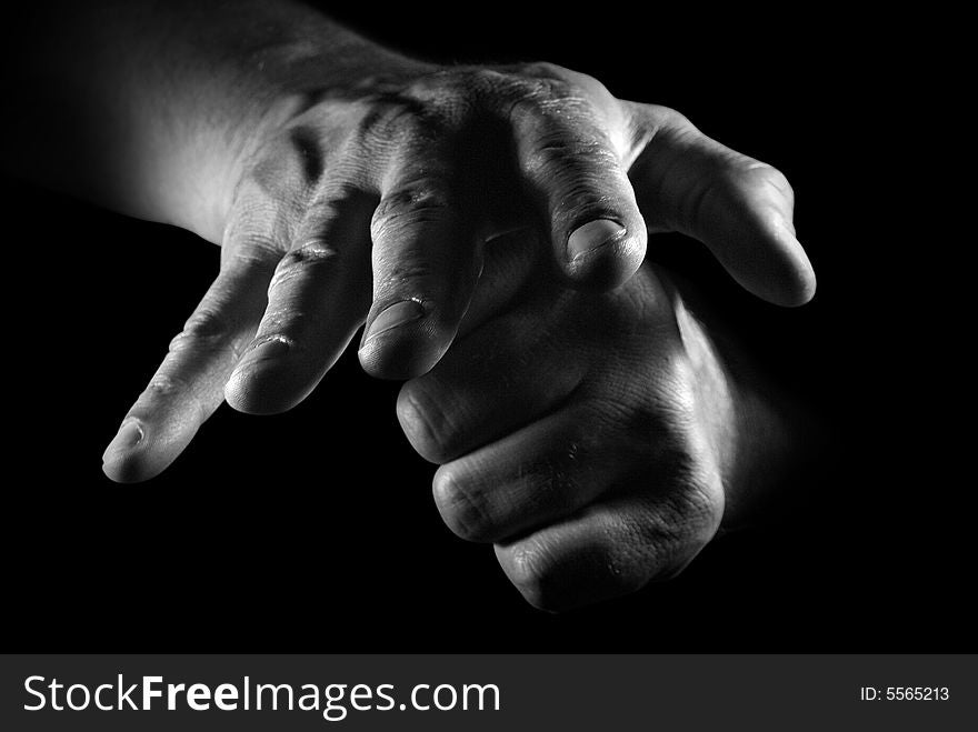 Close-up hands of the man over black. Close-up hands of the man over black