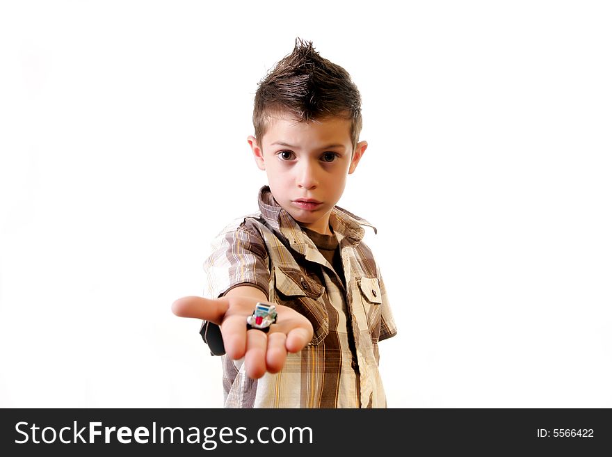 Six year old boy offering a small toy car