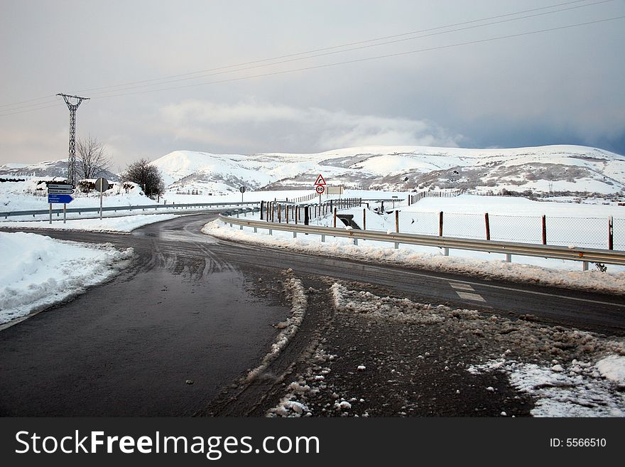 Crossing the roads with a snow in a mountains