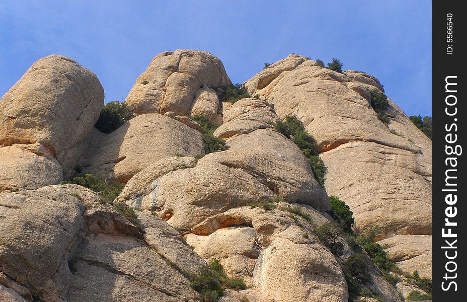 Montserrat is a mountain near Barcelona, in Catalonia, in Spain. It is the site of a Benedictine abbey, Santa Maria de Montserrat, which hosts the Virgin of Montserrat sanctuary and which is identified by some with the location of the Holy Grail in Arthurian myth. Montserrat is a mountain near Barcelona, in Catalonia, in Spain. It is the site of a Benedictine abbey, Santa Maria de Montserrat, which hosts the Virgin of Montserrat sanctuary and which is identified by some with the location of the Holy Grail in Arthurian myth.