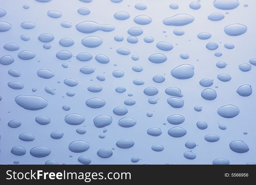 Blue droplets on clean blue  surface
