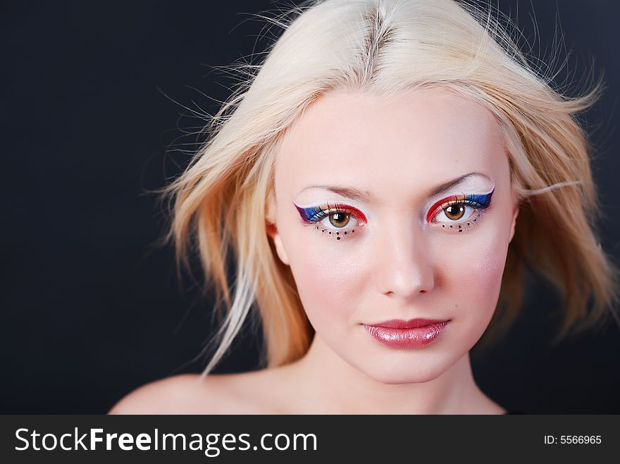 Beautiful young girl with bright make-up and serious look. Beautiful young girl with bright make-up and serious look