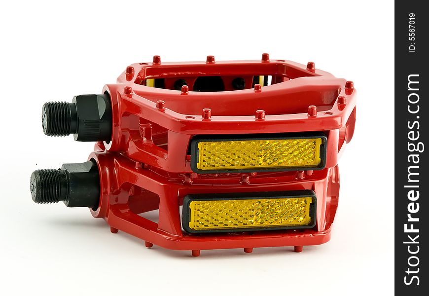 Red cycling pedals isolated on white background