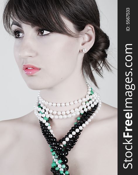 Portrait of beautiful girl with varicoloured beads on a neck. Portrait of beautiful girl with varicoloured beads on a neck