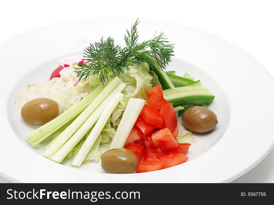 Vegetables on a plate isolated over white. Vegetables on a plate isolated over white.