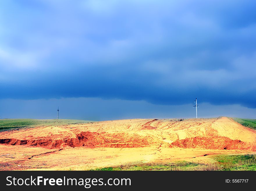 Sand quarry on background blue sky and cloud