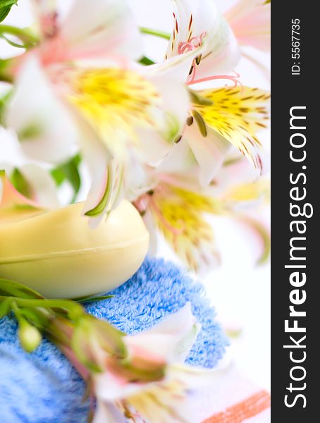 Soap And Flower On Blue Fabric Background