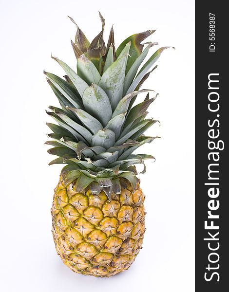 A ripe pineapple on white background