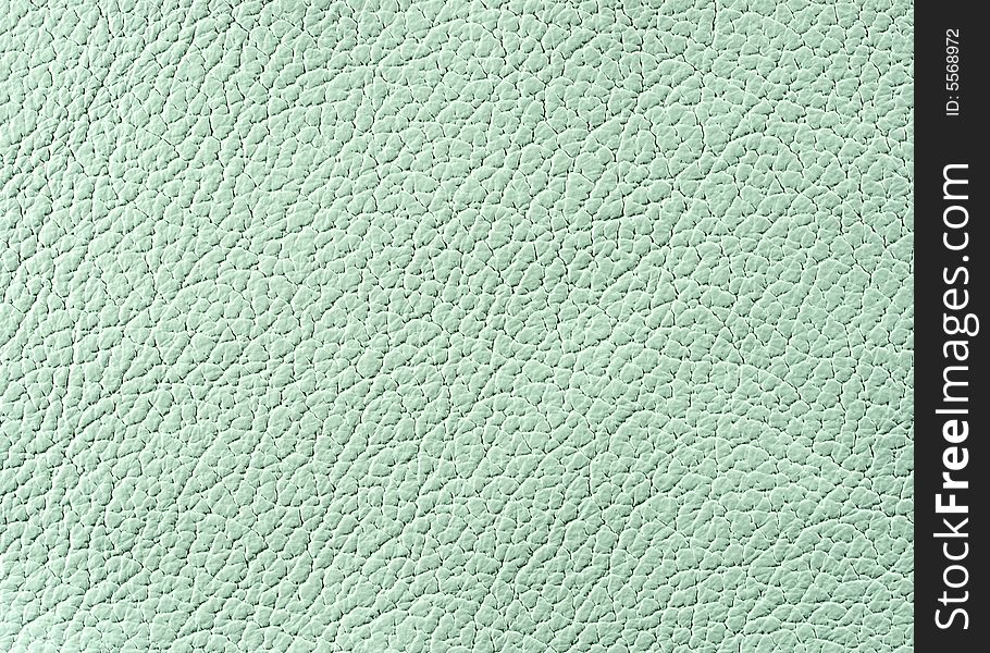 Natural qualitative light green leather texture. Close up. Natural qualitative light green leather texture. Close up.