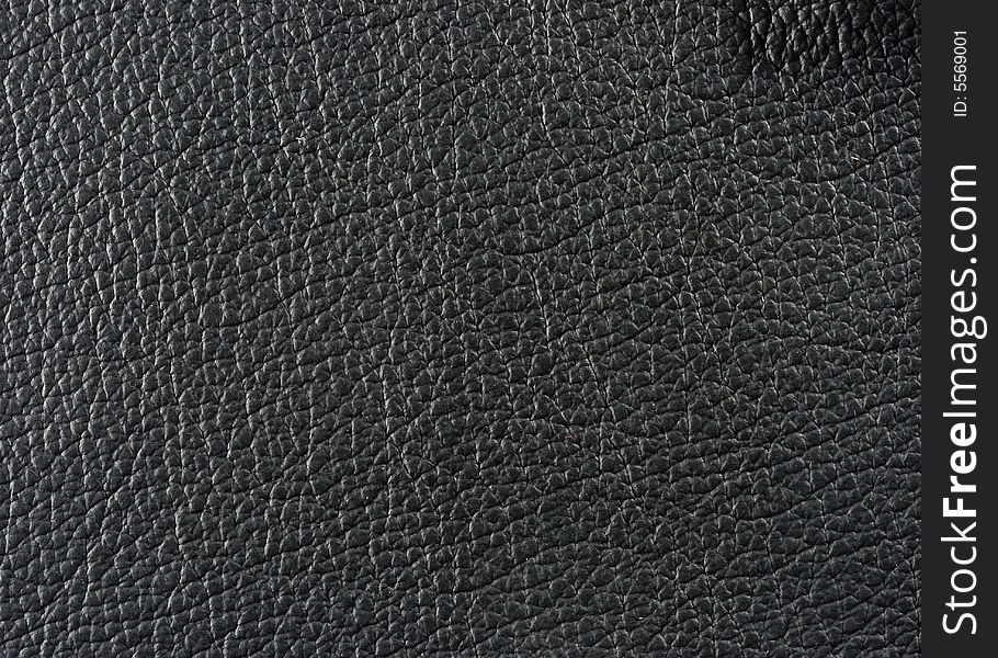 Natural qualitative black leather texture. Close up. Natural qualitative black leather texture. Close up.