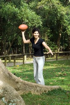 Woman Next To A Tree In A Park Throwing A Footb Stock Image Woman Next To A Tree In A Park Throwing A Footb Stock Image