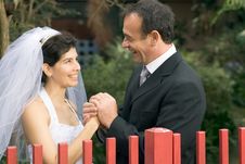 Married Couple Holding Hands Smiling - Horizontal Royalty Free Stock Photo