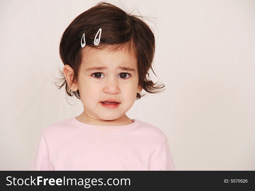 Young toddler girl looking upset after crying. Young toddler girl looking upset after crying
