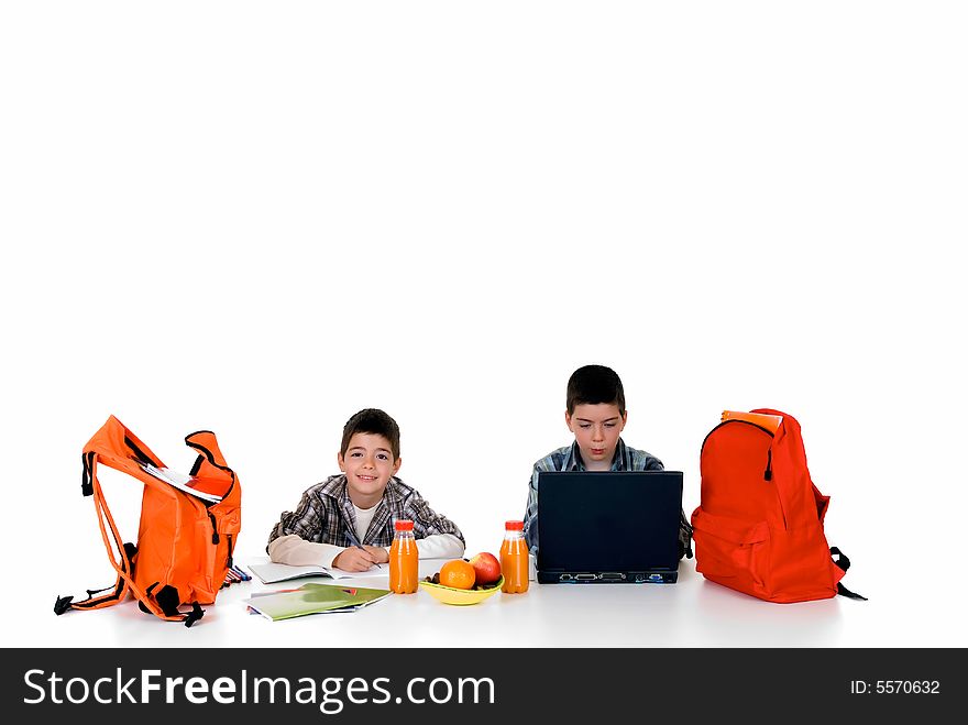 Two young boys doing together studying and homework. Two young boys doing together studying and homework