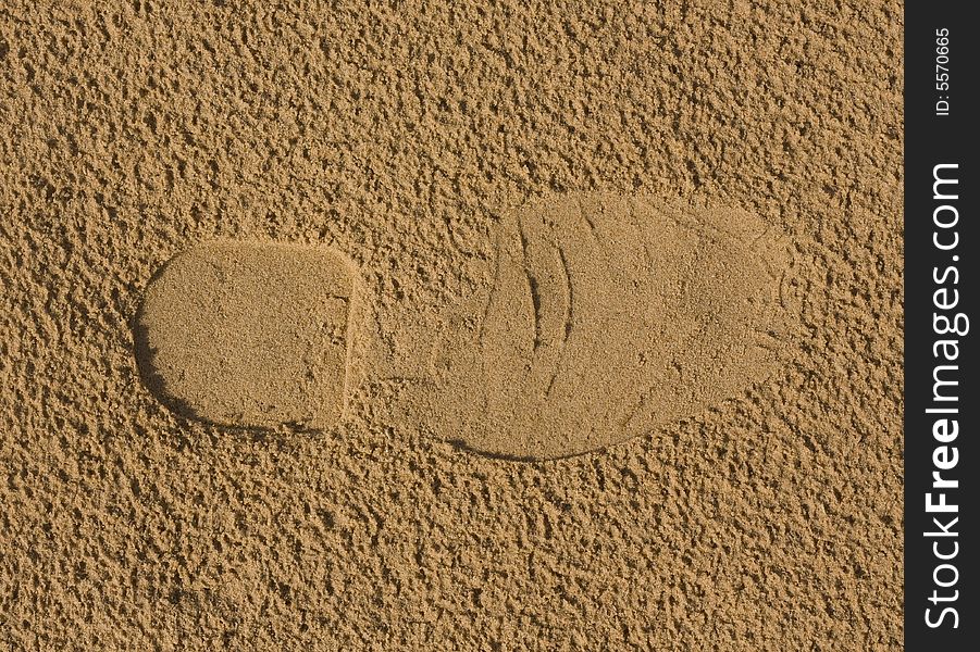 Footprint on sand after rain