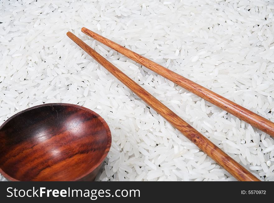 Closeup view of chopsticks and bowl with rice. Closeup view of chopsticks and bowl with rice