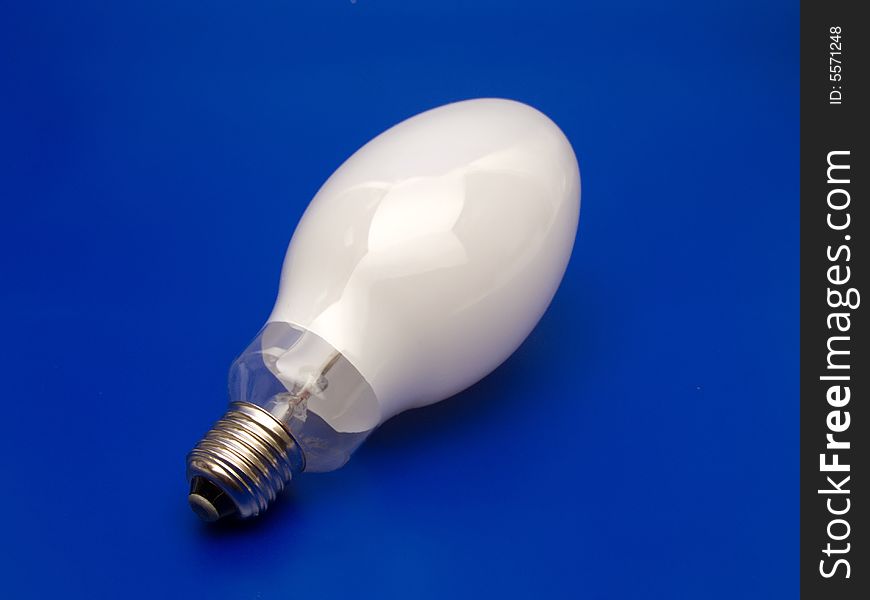 Big Light-bulb on blue background