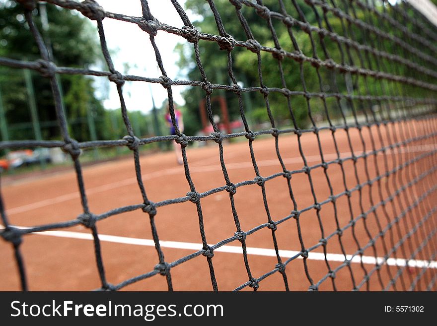 A tennis player girl in action