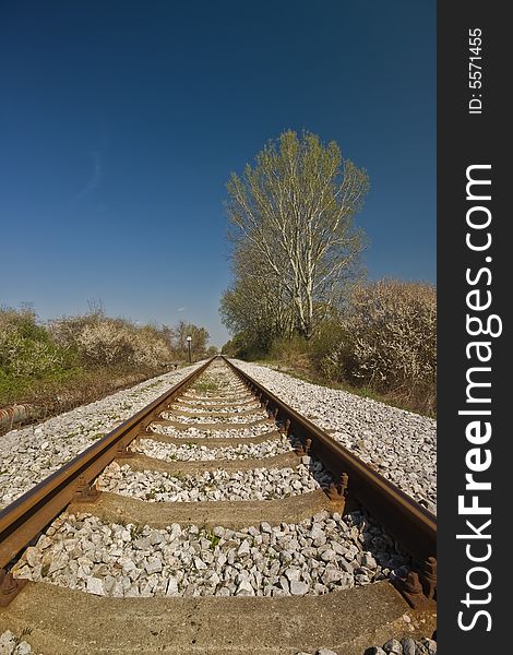 Railroad track vanishing into horizon