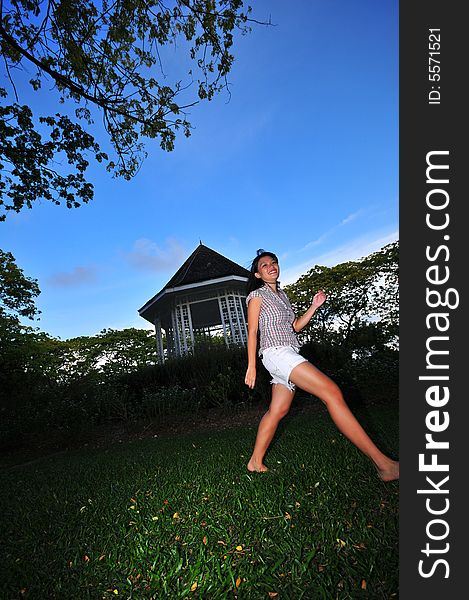 Picture of a Happy Girl out in the park. Indicative of mood, joyous occasion, promotion of healthy living and lifestyle. Picture of a Happy Girl out in the park. Indicative of mood, joyous occasion, promotion of healthy living and lifestyle.