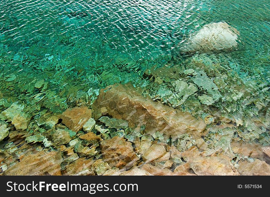 Stones in cold green water