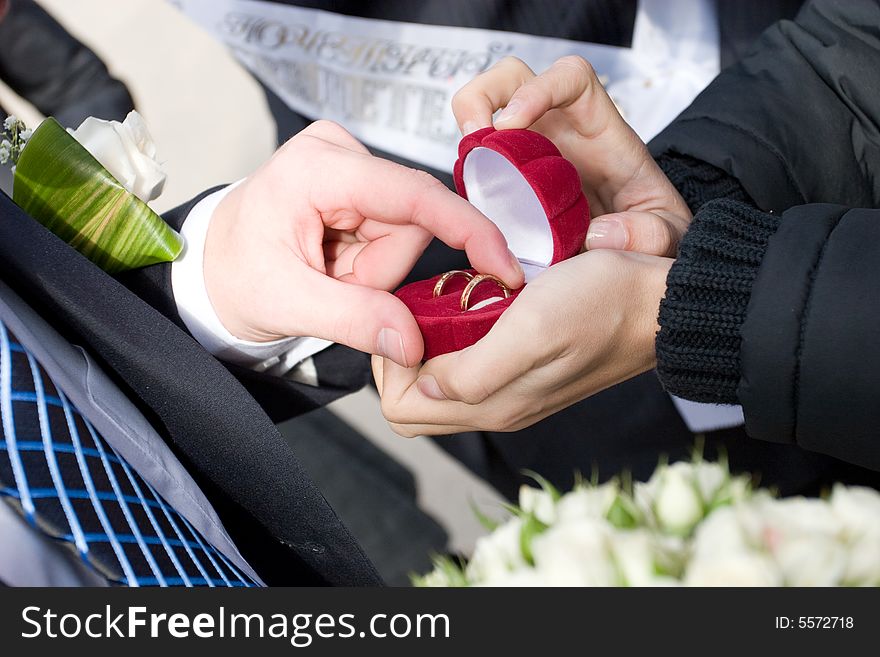 Two wedding rings in the box which takes a man. Two wedding rings in the box which takes a man