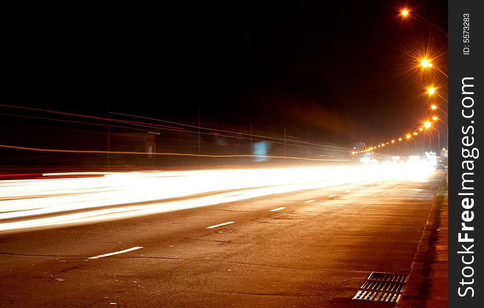 Car lights on highway