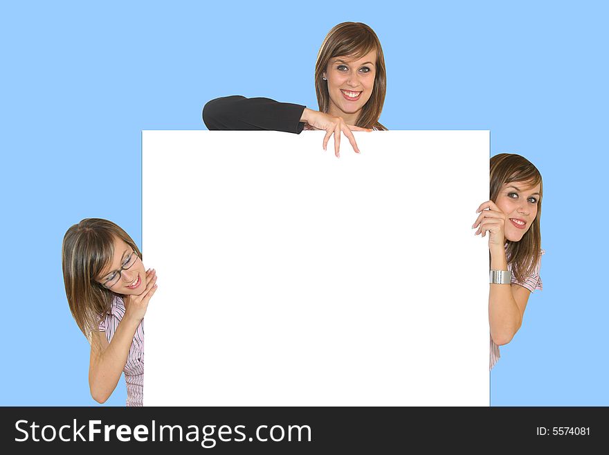 Young business girls with white card on blue background