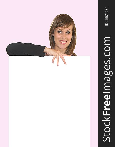 Young business girl with white card on pink background