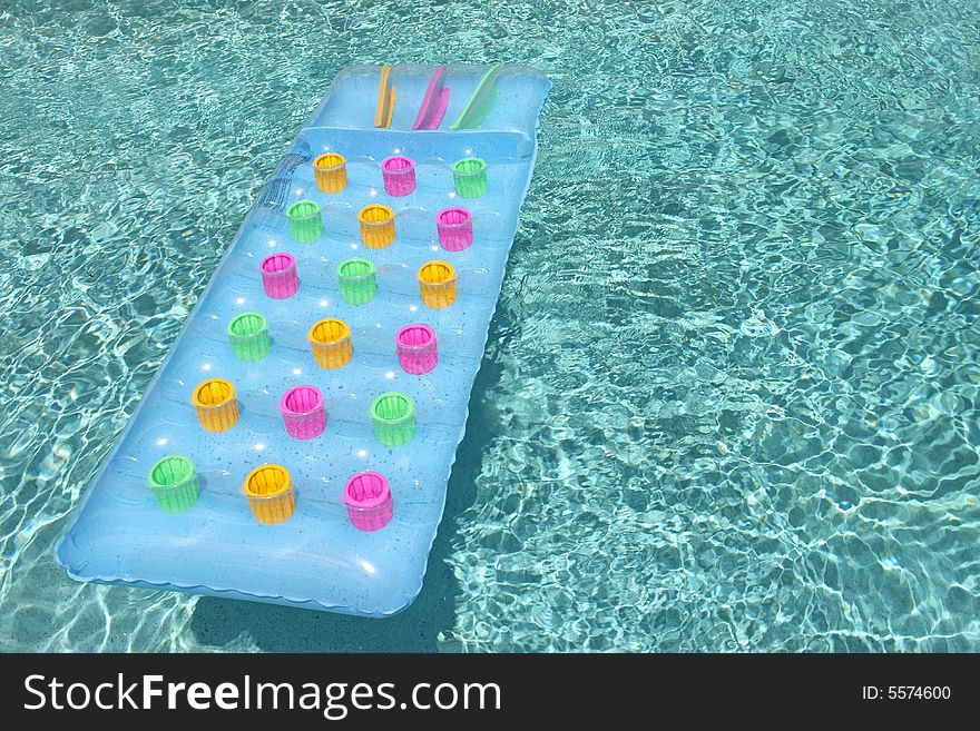 Raft floating in clear swimming pool. Raft floating in clear swimming pool