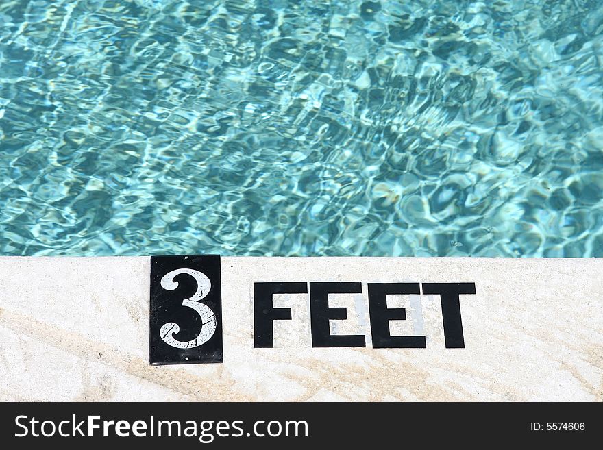 3 Feet depth marking on swimming pool deck. 3 Feet depth marking on swimming pool deck