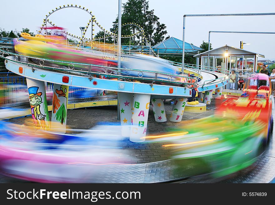 Motion car in amusement park/long time shot