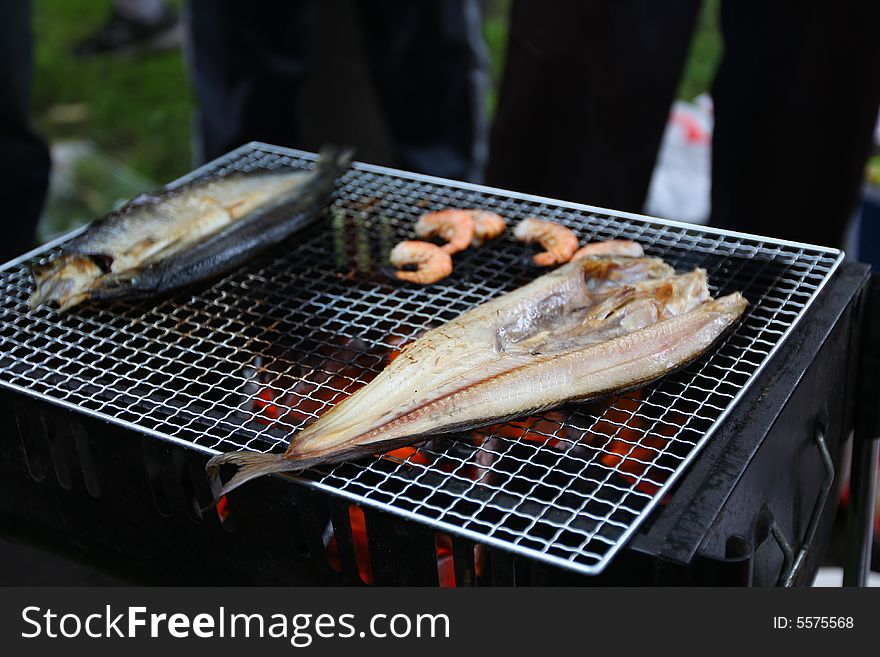 BBQ with variety of foods being prepared