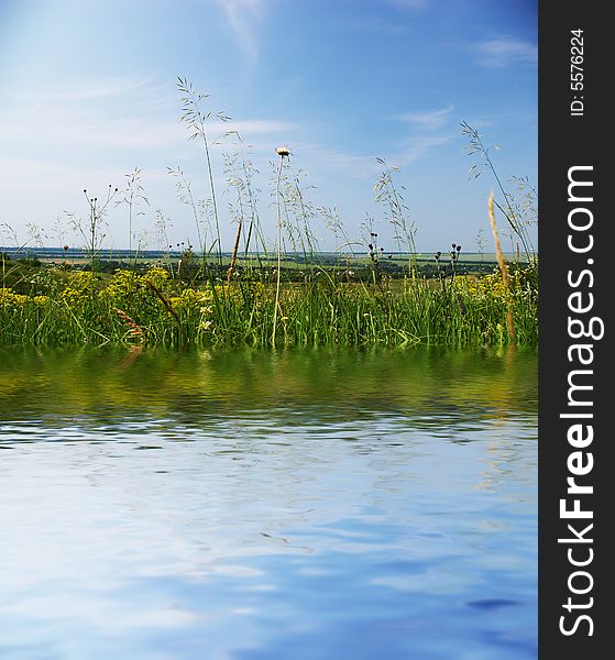 Reflection in a beautiful lake on bright summers day