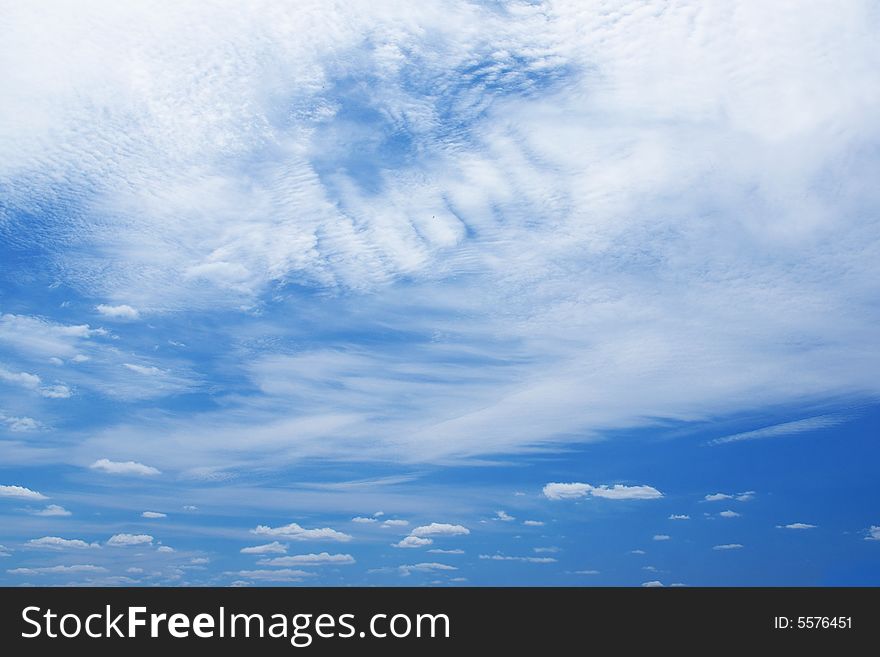 White clouds in a blue sky. Great background. White clouds in a blue sky. Great background
