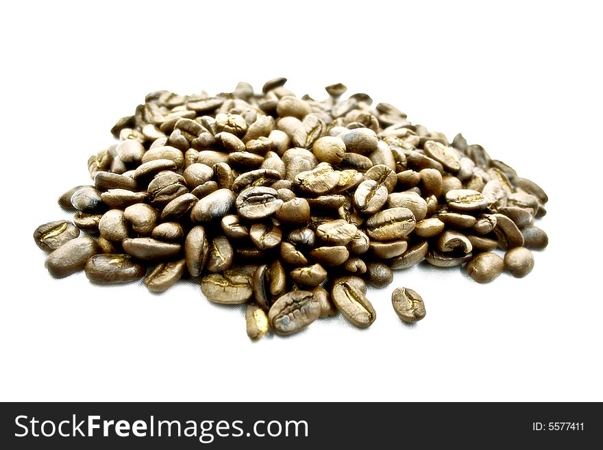 a handful of coffee beans on a white background