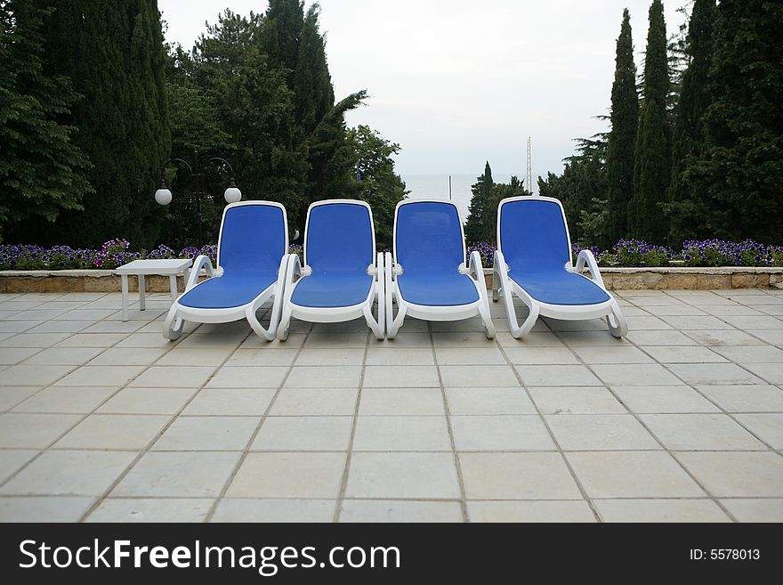 Chairs by swimming pool side. Chairs by swimming pool side