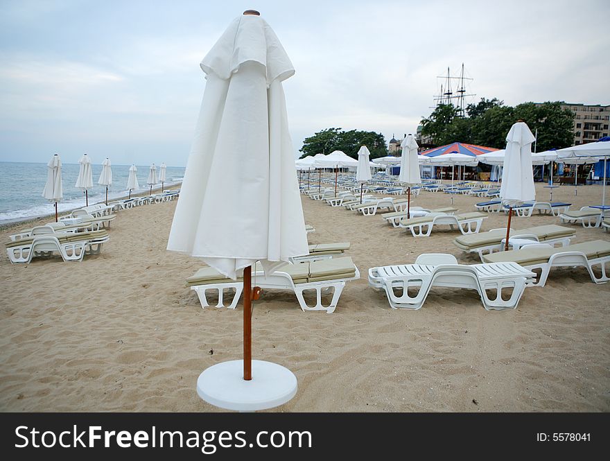 Beach view with chairs and umbrellas. Beach view with chairs and umbrellas