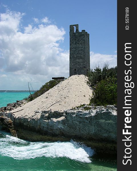 The old fort tower on a small Blue Lagoon island, The Bahamas. The old fort tower on a small Blue Lagoon island, The Bahamas.