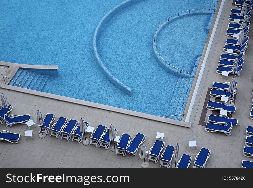 Swimming pool side with chairs