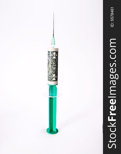 Syringe filled with dollar bill. Syringe filled with dollar bill