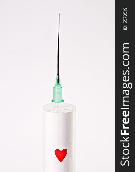 Syringe with heart plaing card
