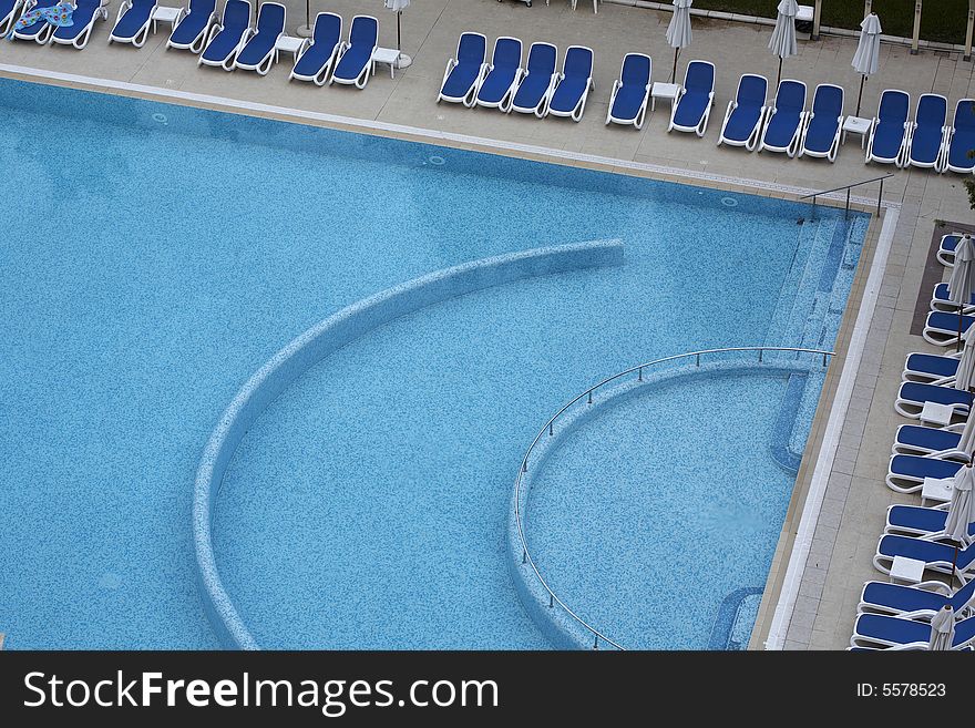 Swimming pool side with chairs