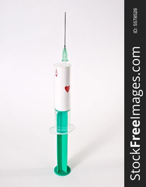 Syringe with ace of hearts