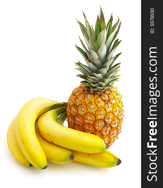 Pineapple and bananas isolated on the white background. Pineapple and bananas isolated on the white background