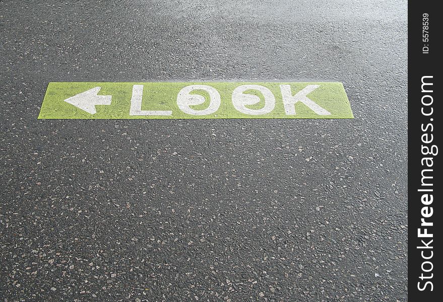 Green look sign painted on the pavement